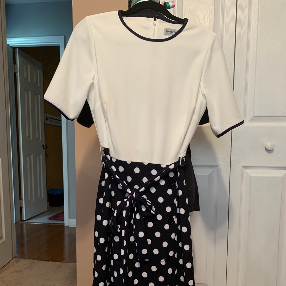 White and black/white polka dot dress.